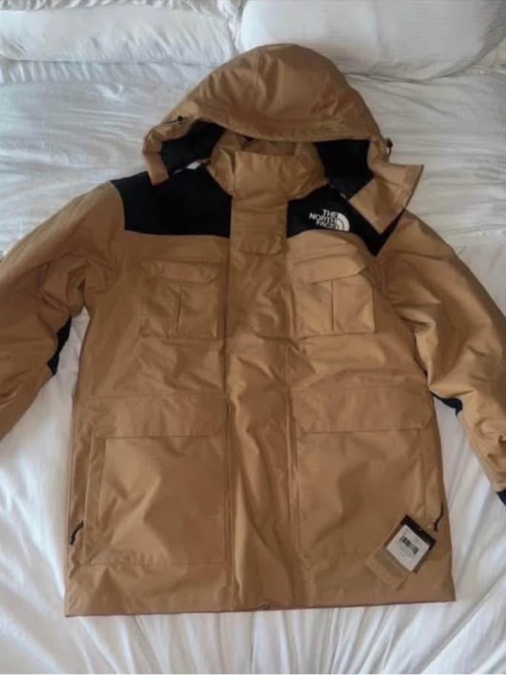 The North Face Men’s Hooded Puffer Jacket in Tan with Black Yoke